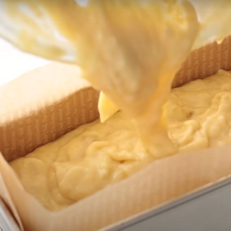 Pouring batter into loaf pan