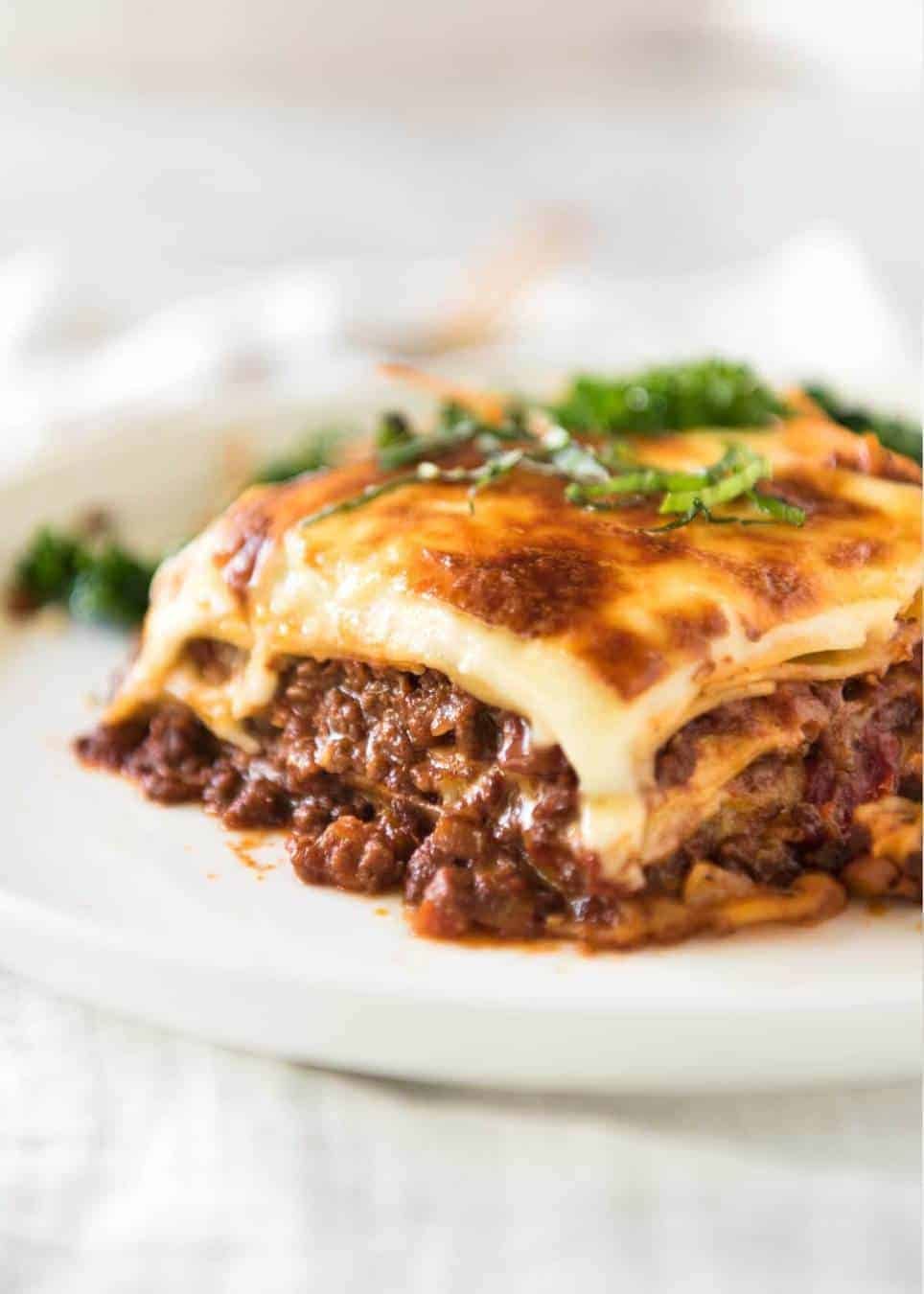 Rich meat sauce layering in a lasagna dish