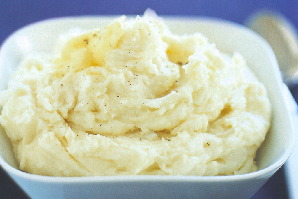Mashing potatoes with butter and milk