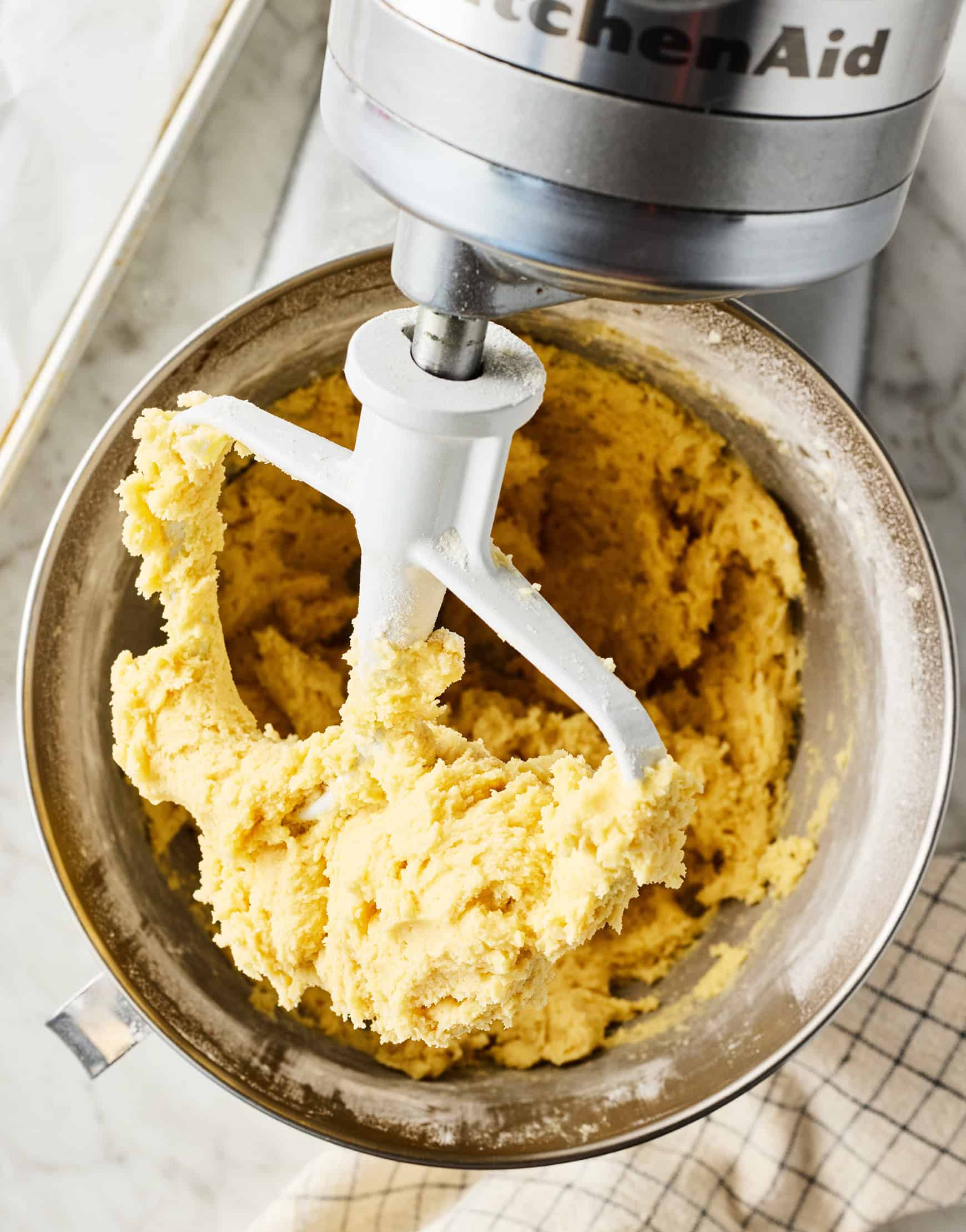 Cookie dough being mixed in a stand mixer