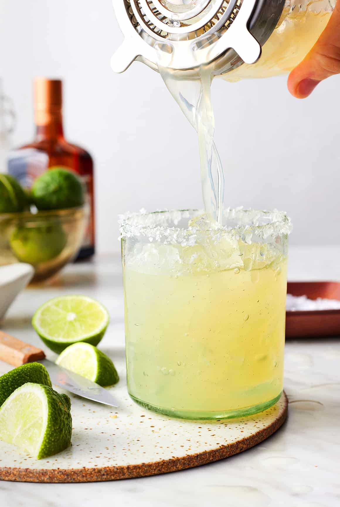 Pouring margarita into glass
