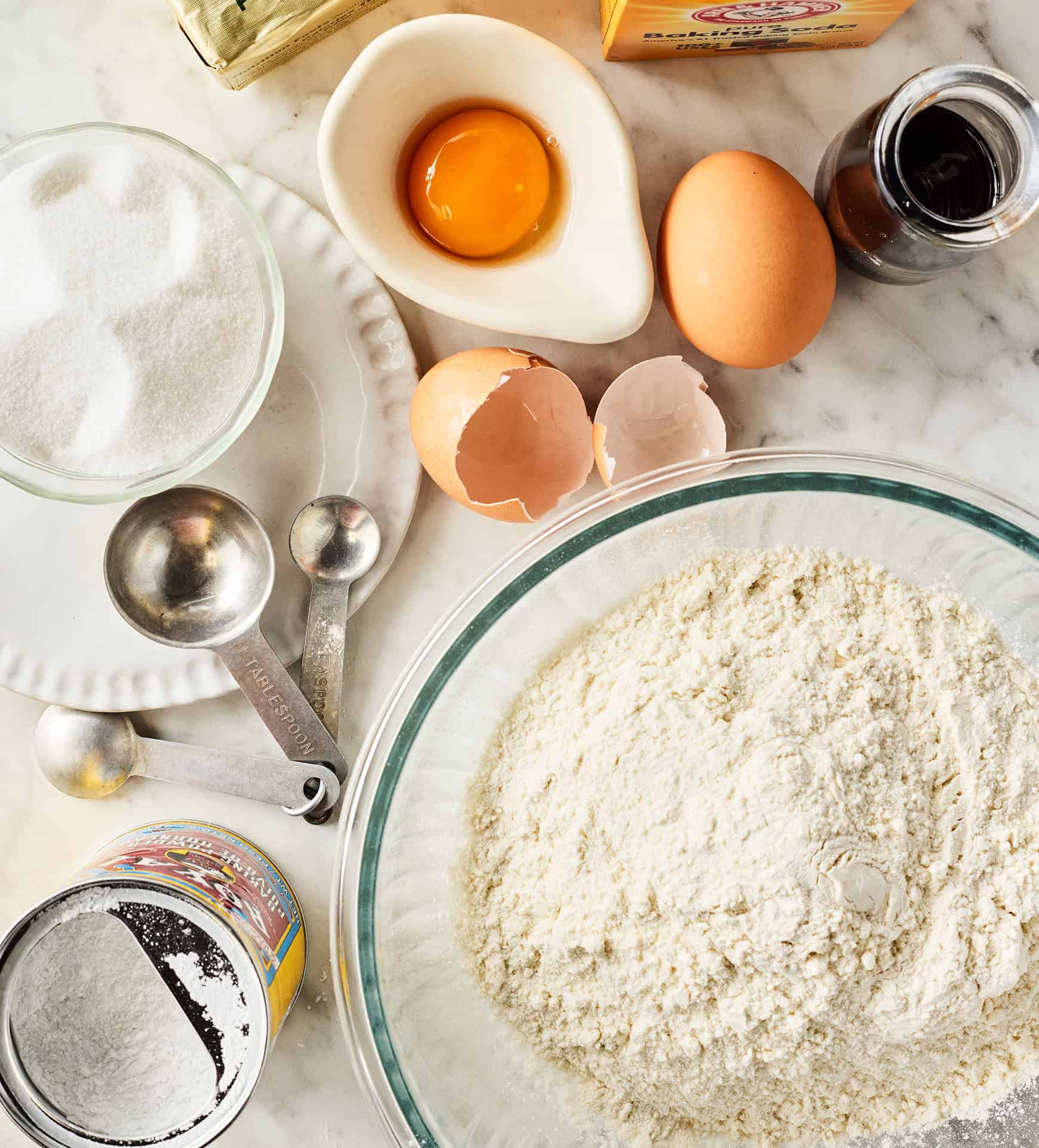 Sugar cookie ingredients laid out on a table