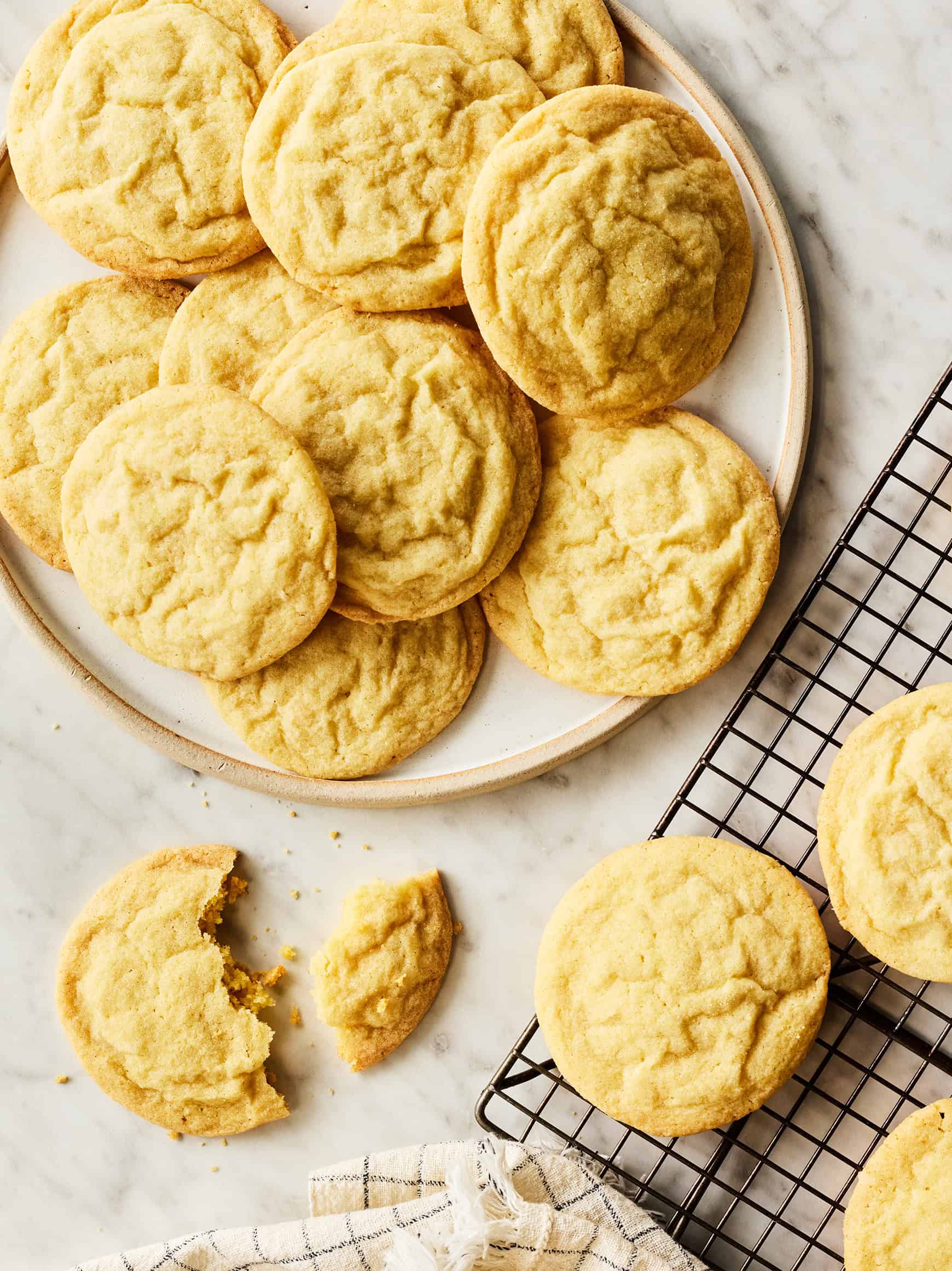 Stack of soft and chewy sugar cookies on a cooling rack